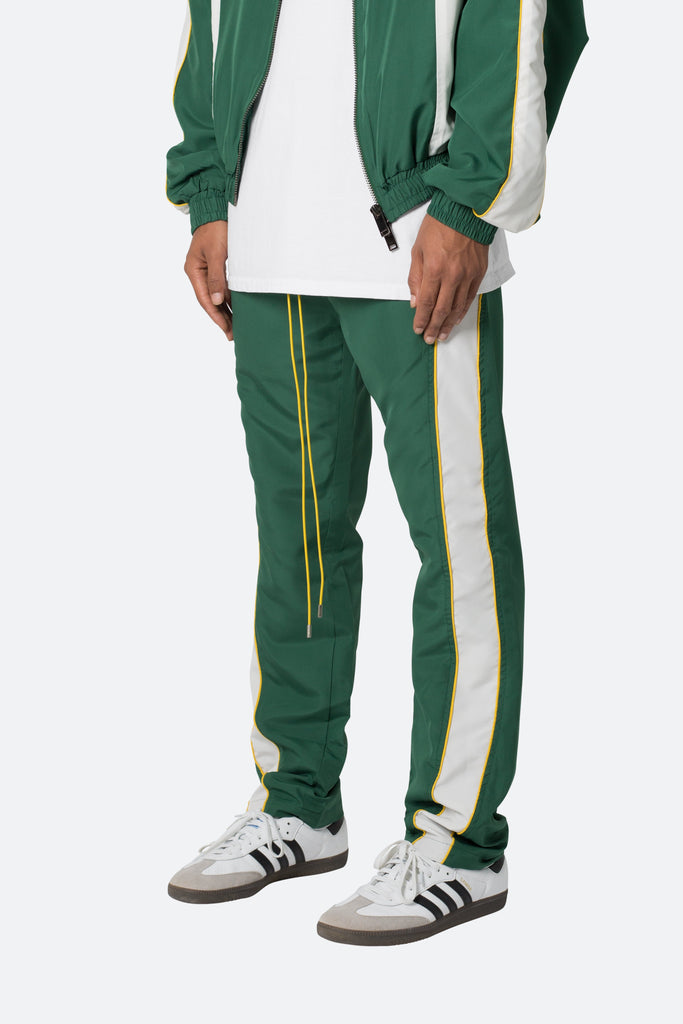 Green and white track pants on sale